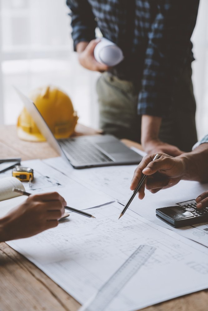 Architectural,Engineer,Team,Meeting,Use,Of,Blueprints,,Construction,Drawings,And